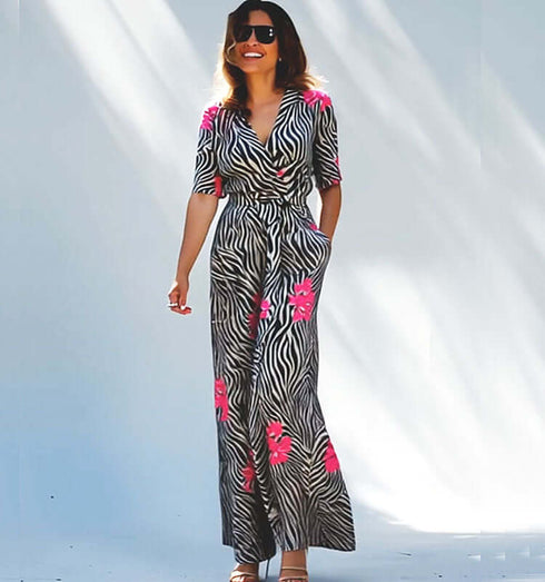 אוורול ארוך שחור לבן עם נגיעות ורודות ושרוול קצר, מתאים לאירועים יומיומיים וערב.