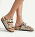 Stylish cork sandals adorned with beads and shells, featuring gold buckles for a chic summer look.
