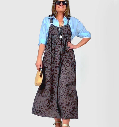 Stylish brown leopard print linen sundress with straps, paired with a light blue shirt for a trendy summer look.