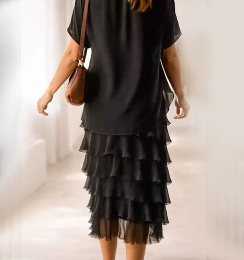 שמלת שכבות מבד ממשי פראי בגוון שחור עם עליונית שיפון שקופה